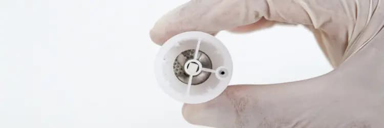 Rigeneracons device grid held in a sterile glove